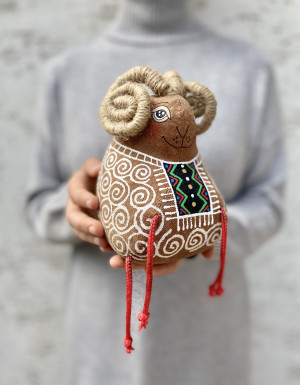 Lamb in an embroidered shirt
