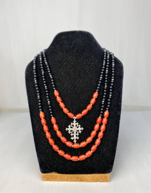 Three-strand coral and shungite necklace with a silver cross
