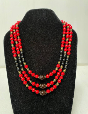 The necklace is red and black in three rows