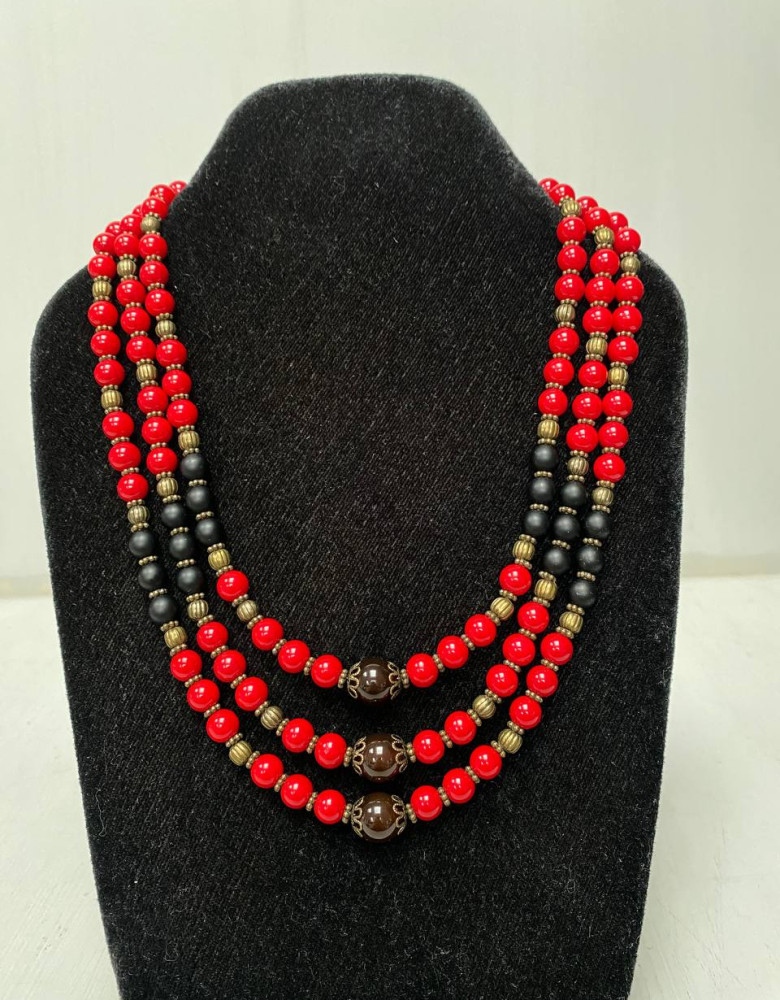 The necklace is red and black in three rows