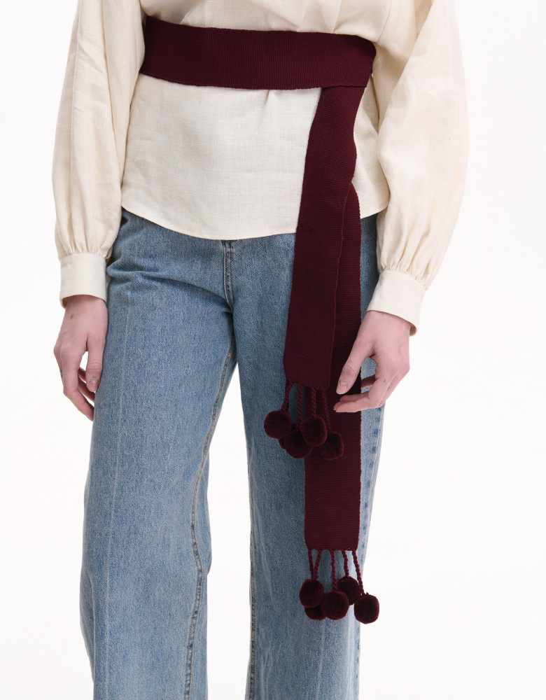 Burgundy woven belt with pom-poms