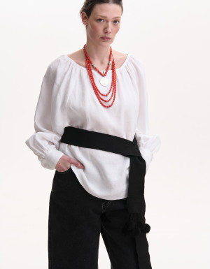 Black woven belt with pom-poms