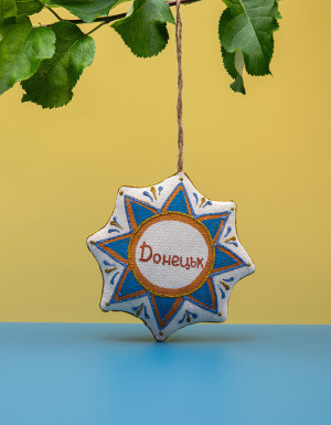 Souvenir vanilla star "Donetsk Airport with angel"