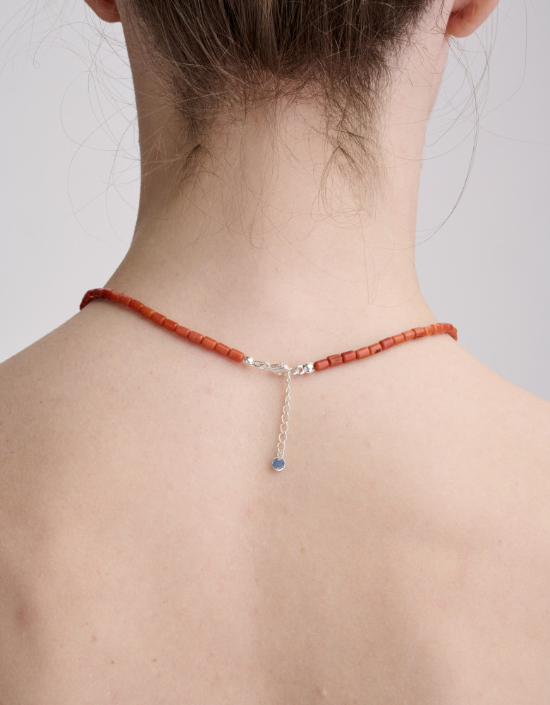 One string terracotta coral necklace, silver trident