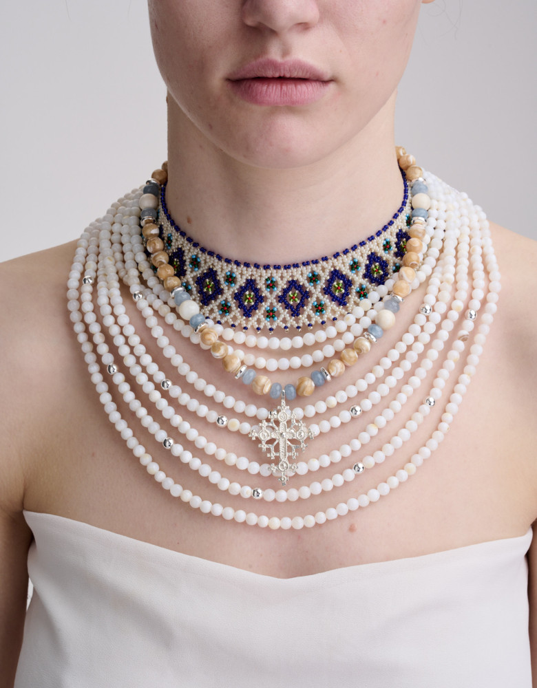 A necklace set with mother-of-pearl, abalone shell, and peasant-style chokers