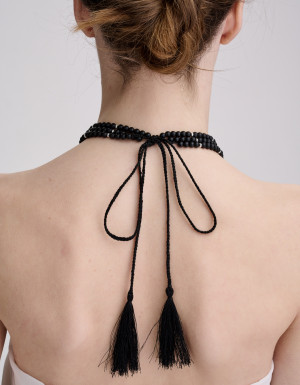  Three-strand coral and shungite necklace with a silver cross