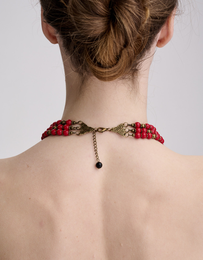 The necklace is red and black in three rows
